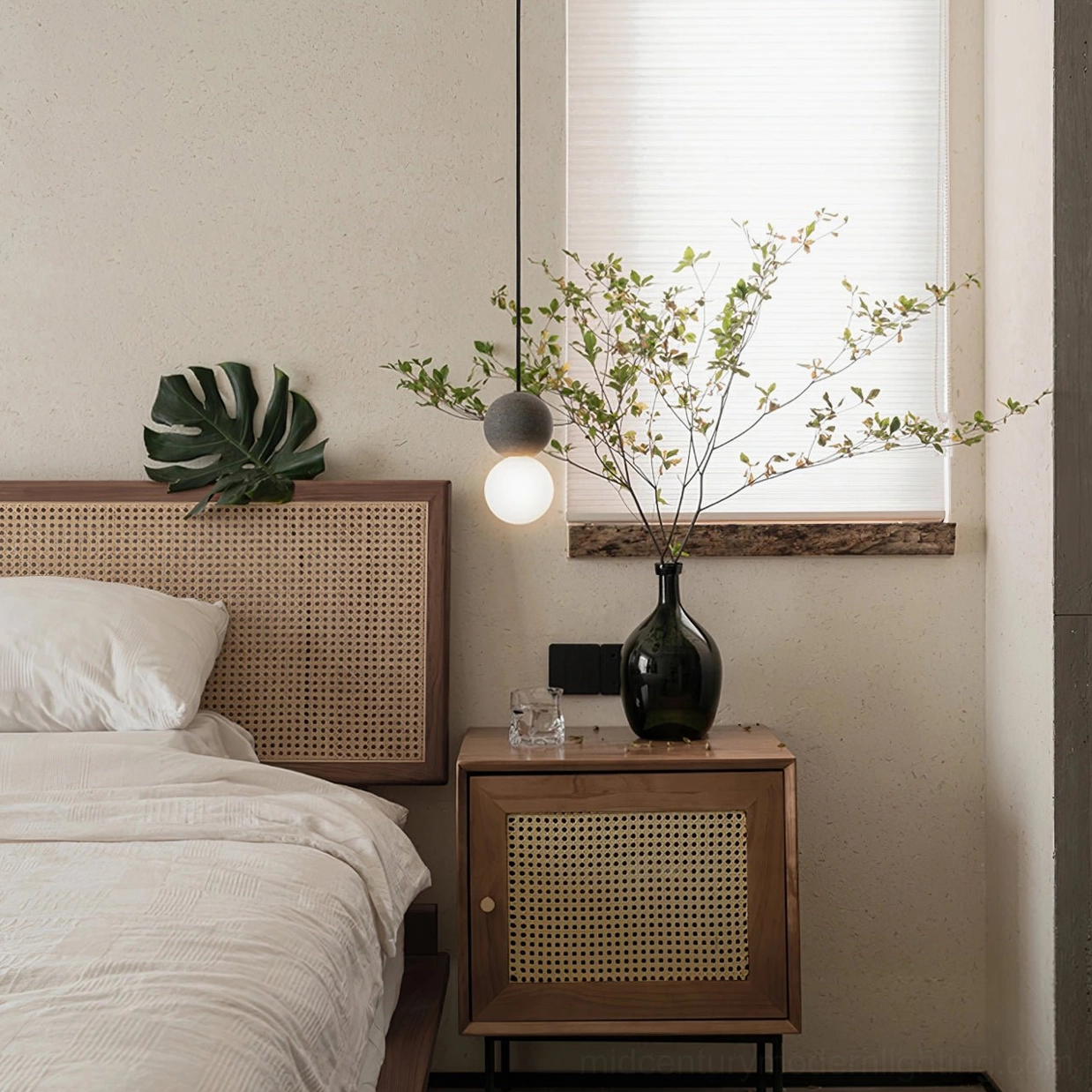 Single terrazzo ball pendant lamp bedside with rattan nightstand, japandi style