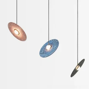 Multiple color terrazzo pendant lamps - black, white, pink, and blue options displayed flat lay studio shot