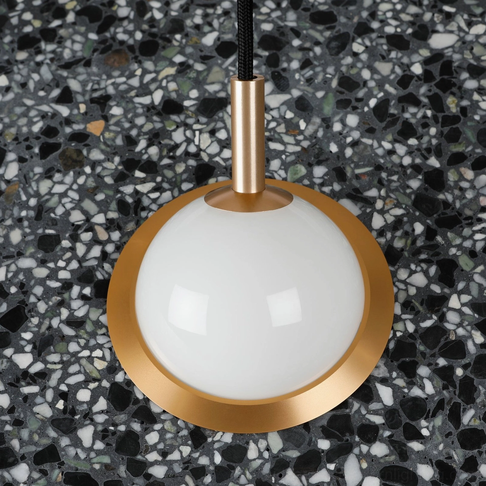 Terrazzo pendant light showing speckled material pattern in natural daylight