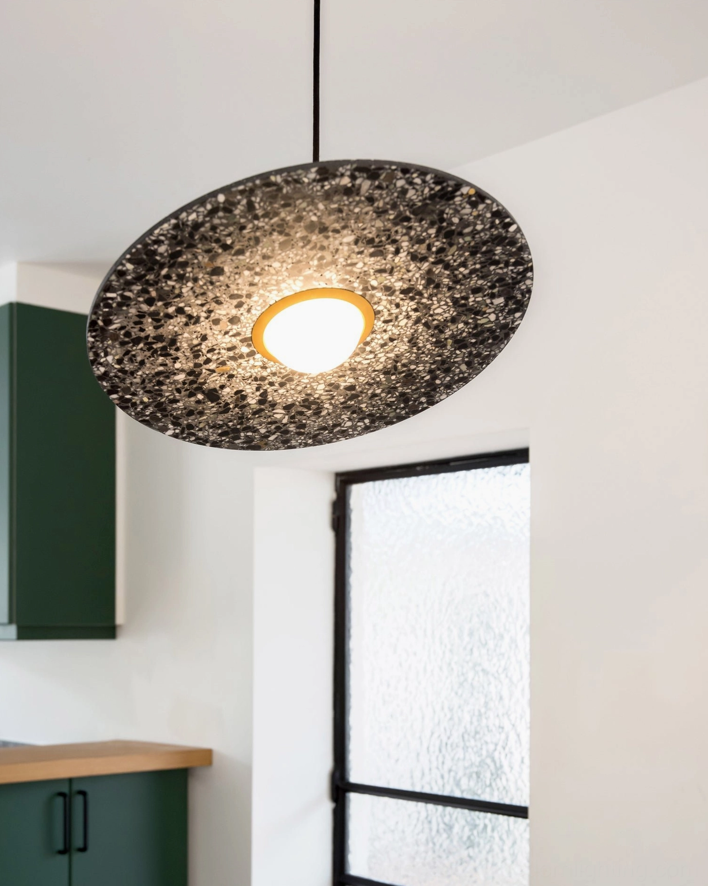 Terrazzo pendant light in Scandinavian minimalist home office workspace lighting