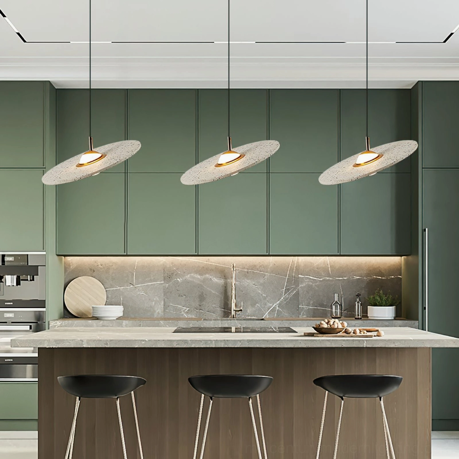 Three white terrazzo pendant lights above kitchen island in green cabinet minimalist modern kitchen