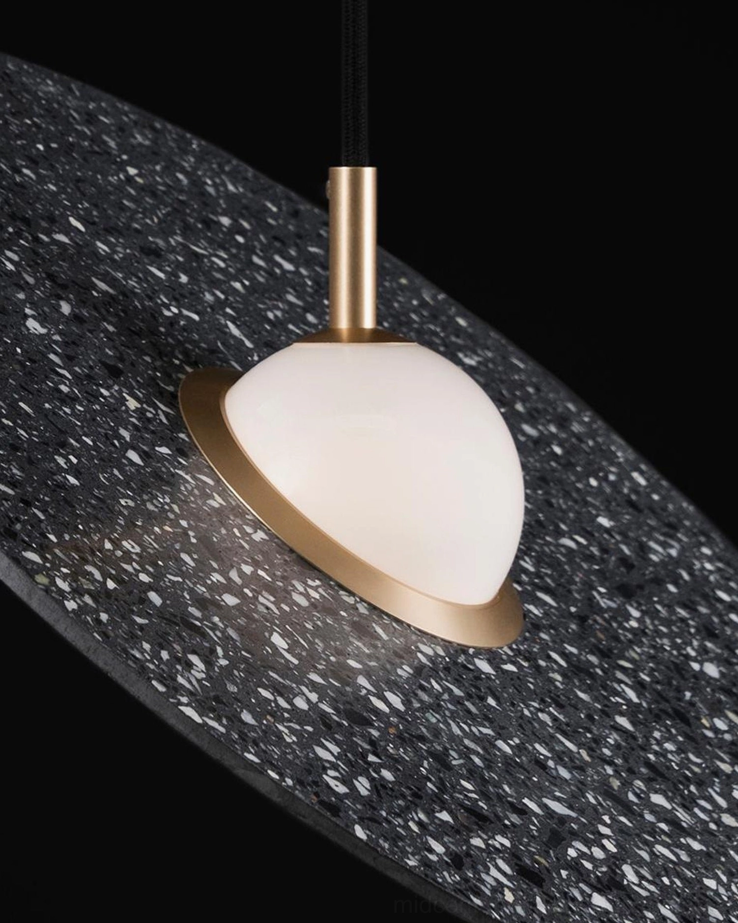 Multiple terrazzo pendant lights creating layered ambient lighting in open concept space