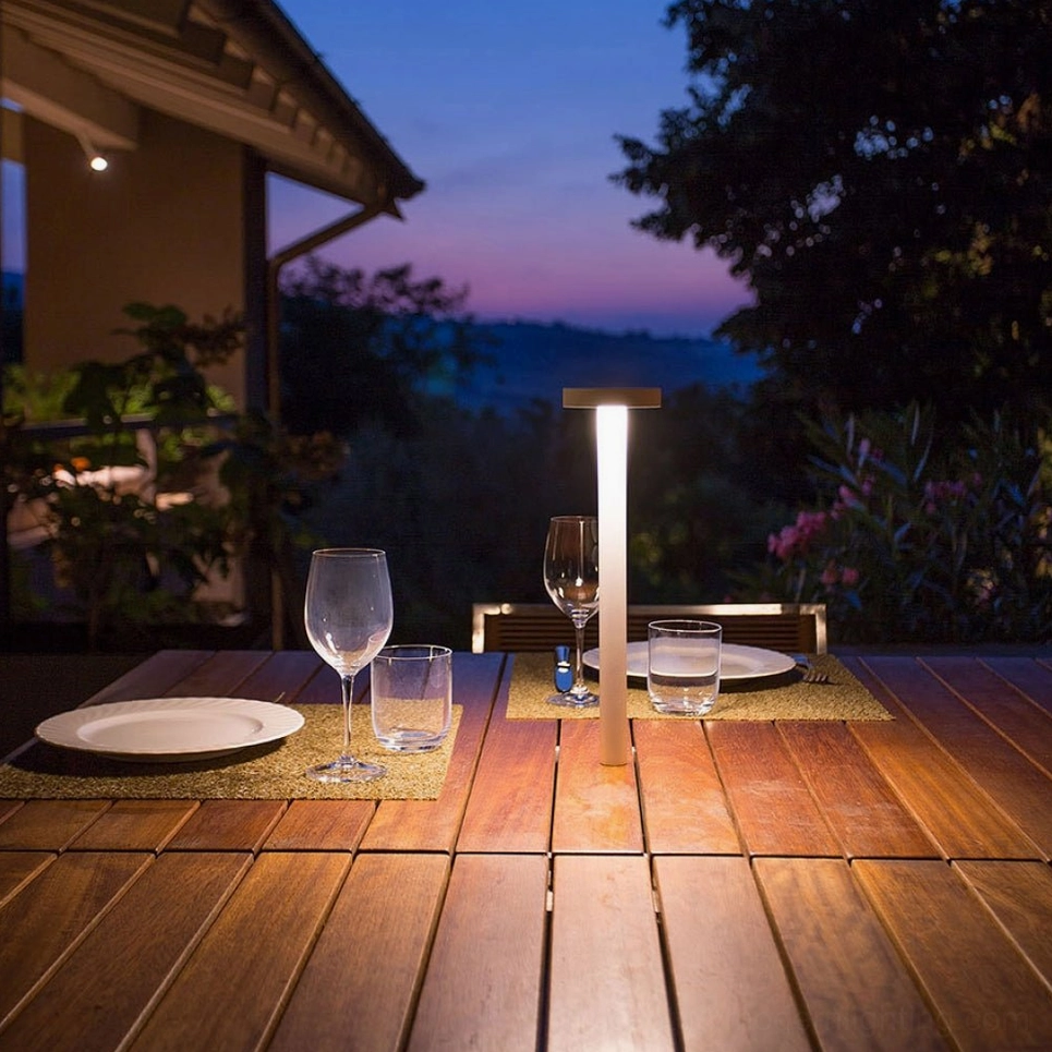 Tetatet cordless lamp outdoor wooden patio dusk minimalist white design evening ambiance