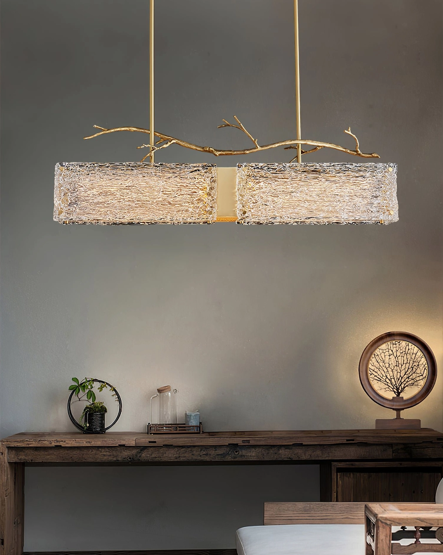 Thalassa brass and frosted glass chandelier interior installation view showing warm ambient lighting effect in residential space