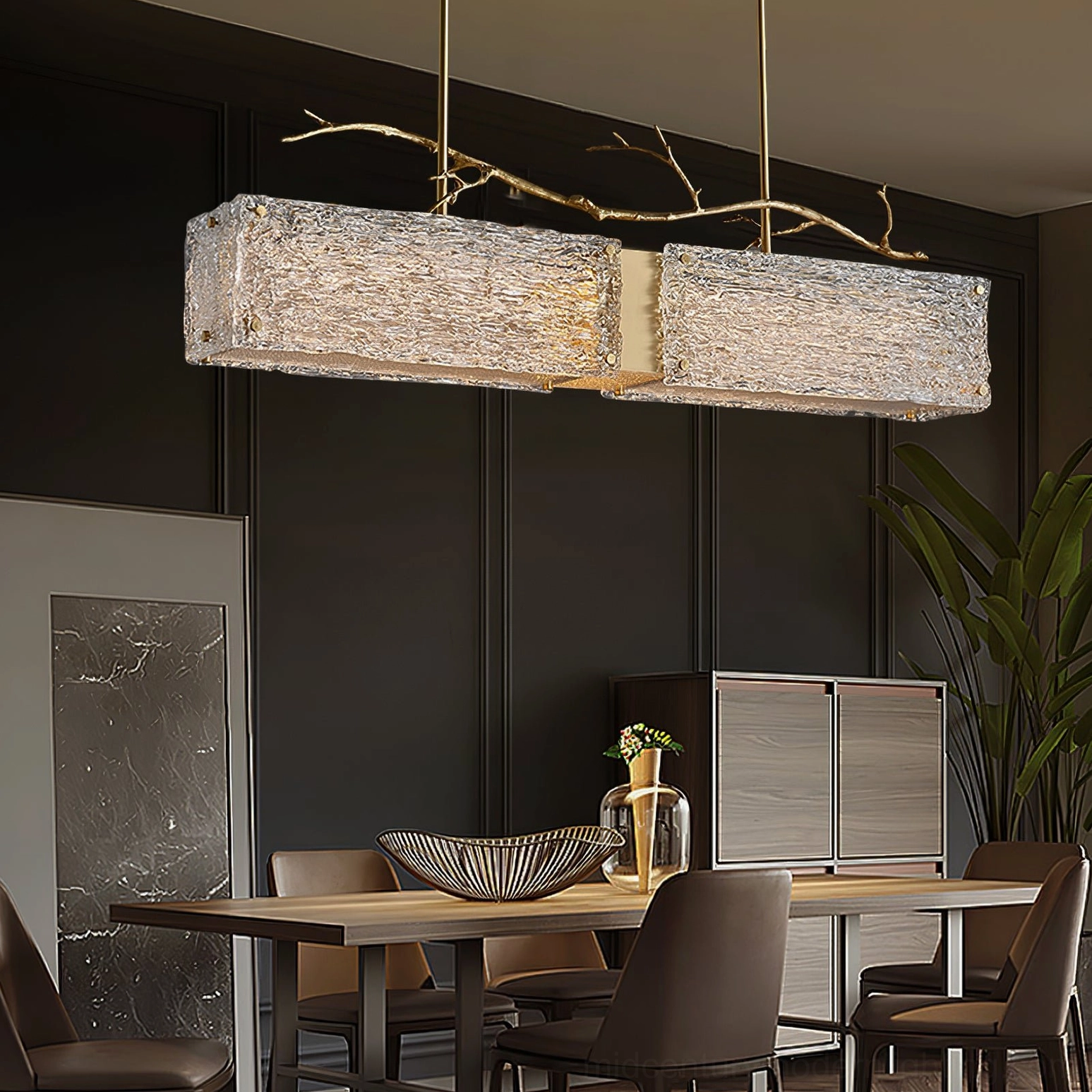 Thalassa textured glass branch chandelier in dark-paneled modern dining room with gold metal accents and natural branch styling