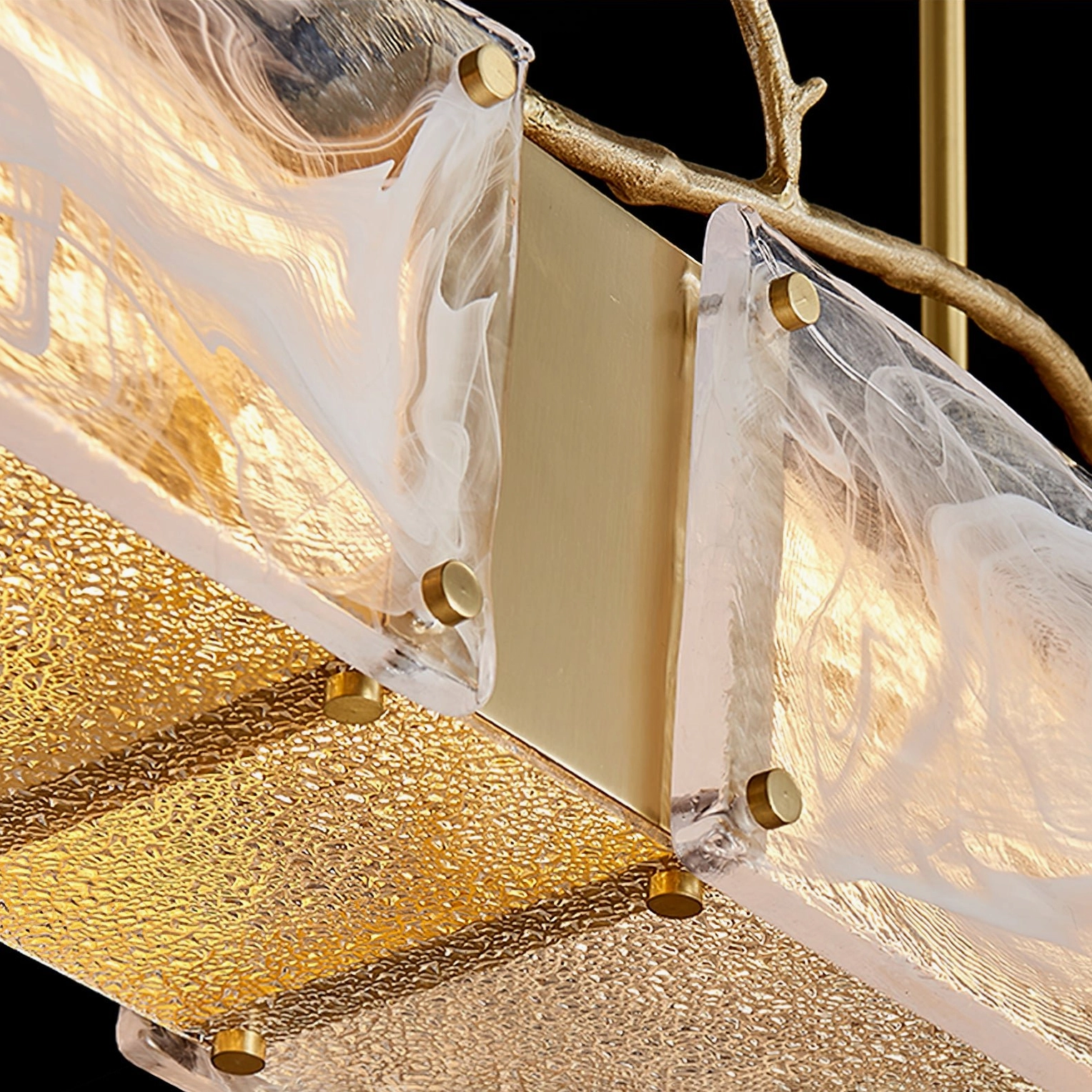 Thalassa glass branch pendant light close-up highlighting precision glass cutting and brass connection points structural details