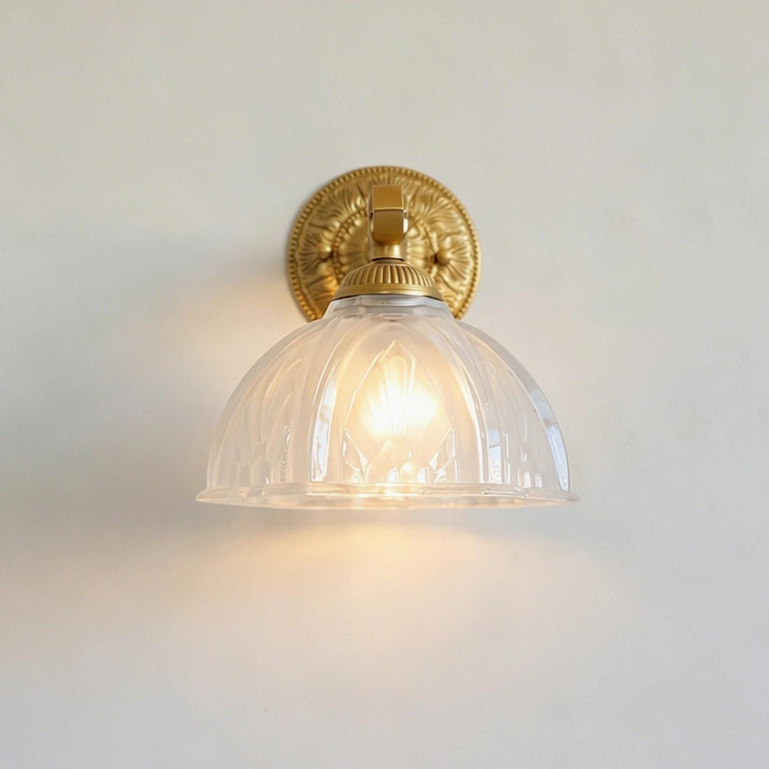 Thayer brass wall sconce installed in mid-century modern bedroom reading alcove