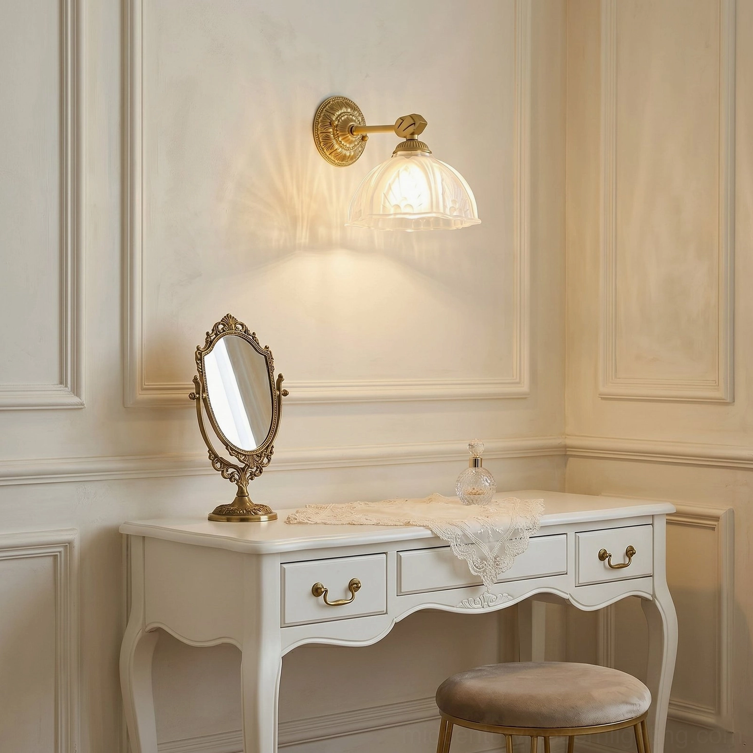 Thayer vintage brass sconce installed above white vanity with gold hardware in neoclassical bathroom