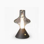 Black Theater rechargeable LED table lamp with clear glass shade, front studio view