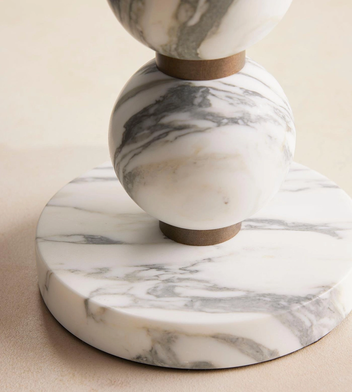 Thelma lamp bottom section showing round marble base and sphere stack foundation with bronze accents