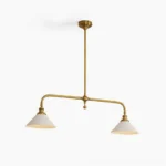 Theron mid-century brass chandelier with dual conical white shades, frontal studio view showcasing symmetrical linear design and brushed brass finish