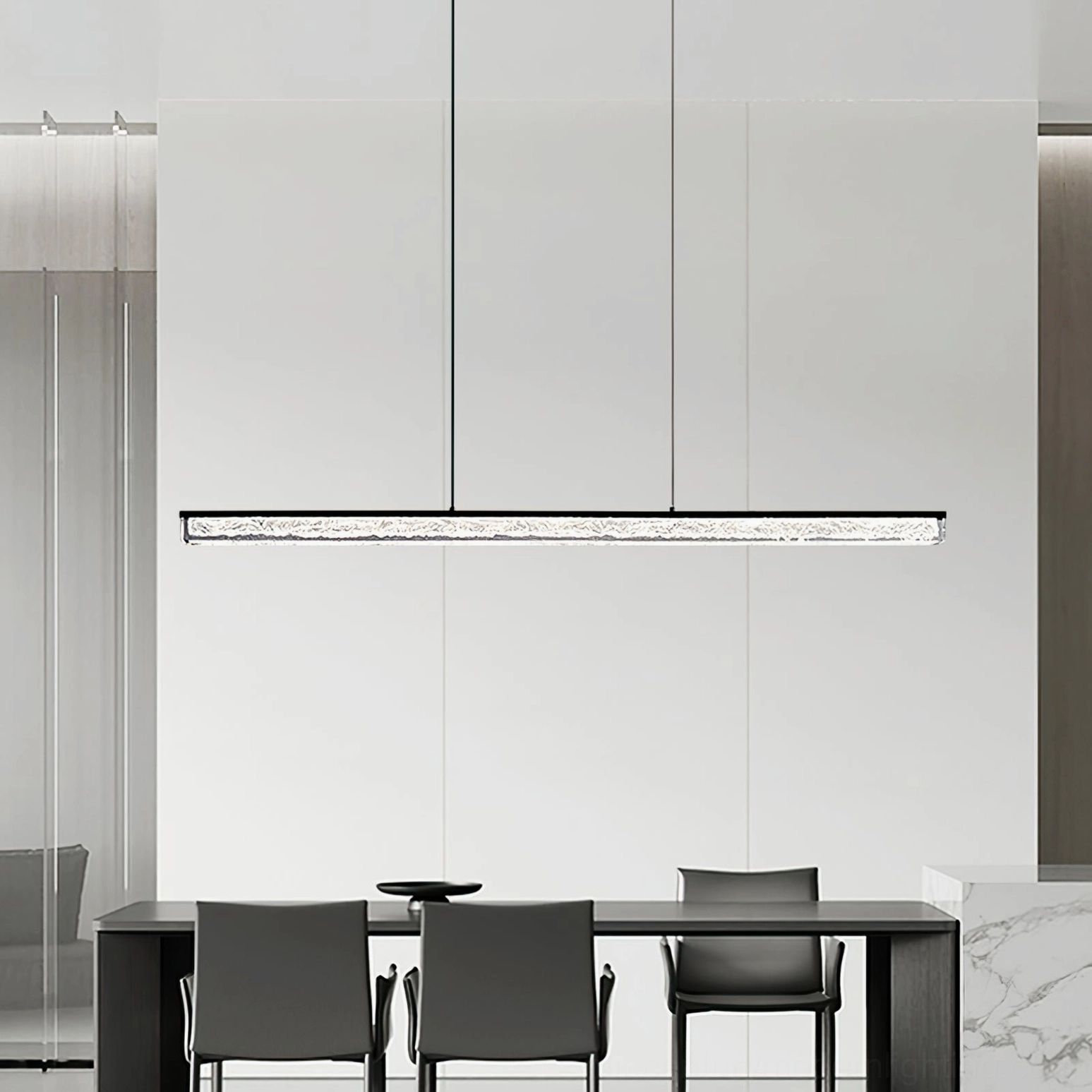 Sleek black linear pendant chandelier in neutral monochrome modern dining space with low angle view