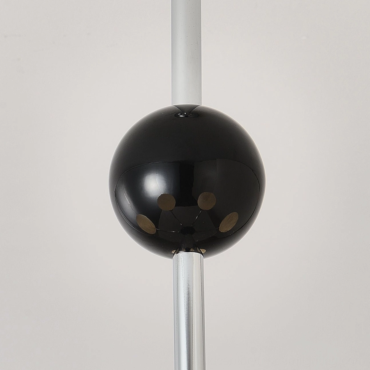 Three-head spherical chandelier in minimalist white and chrome color scheme
