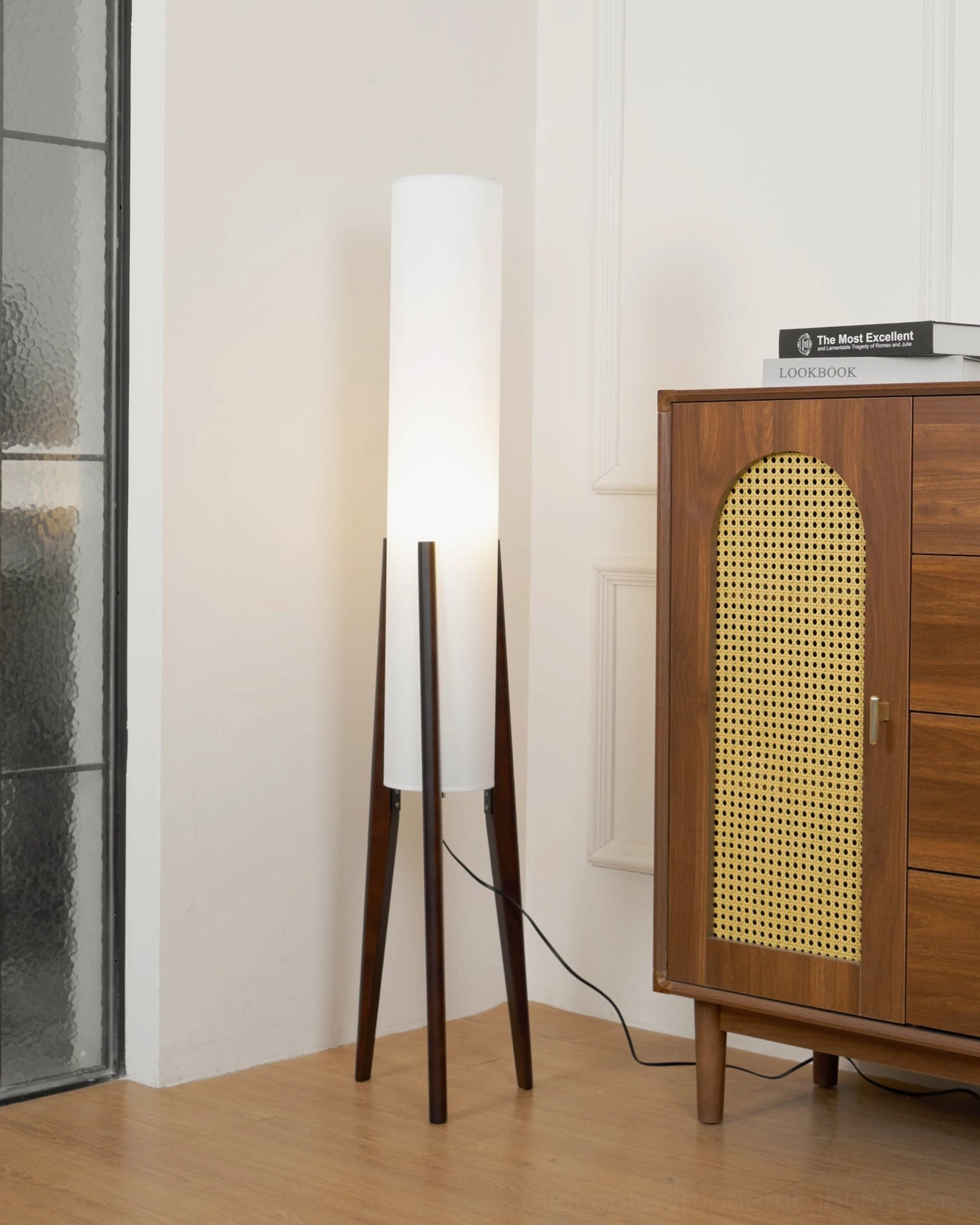 Three-legged walnut tripod floor lamp with cream linen cylinder shade, mid-century modern lighting