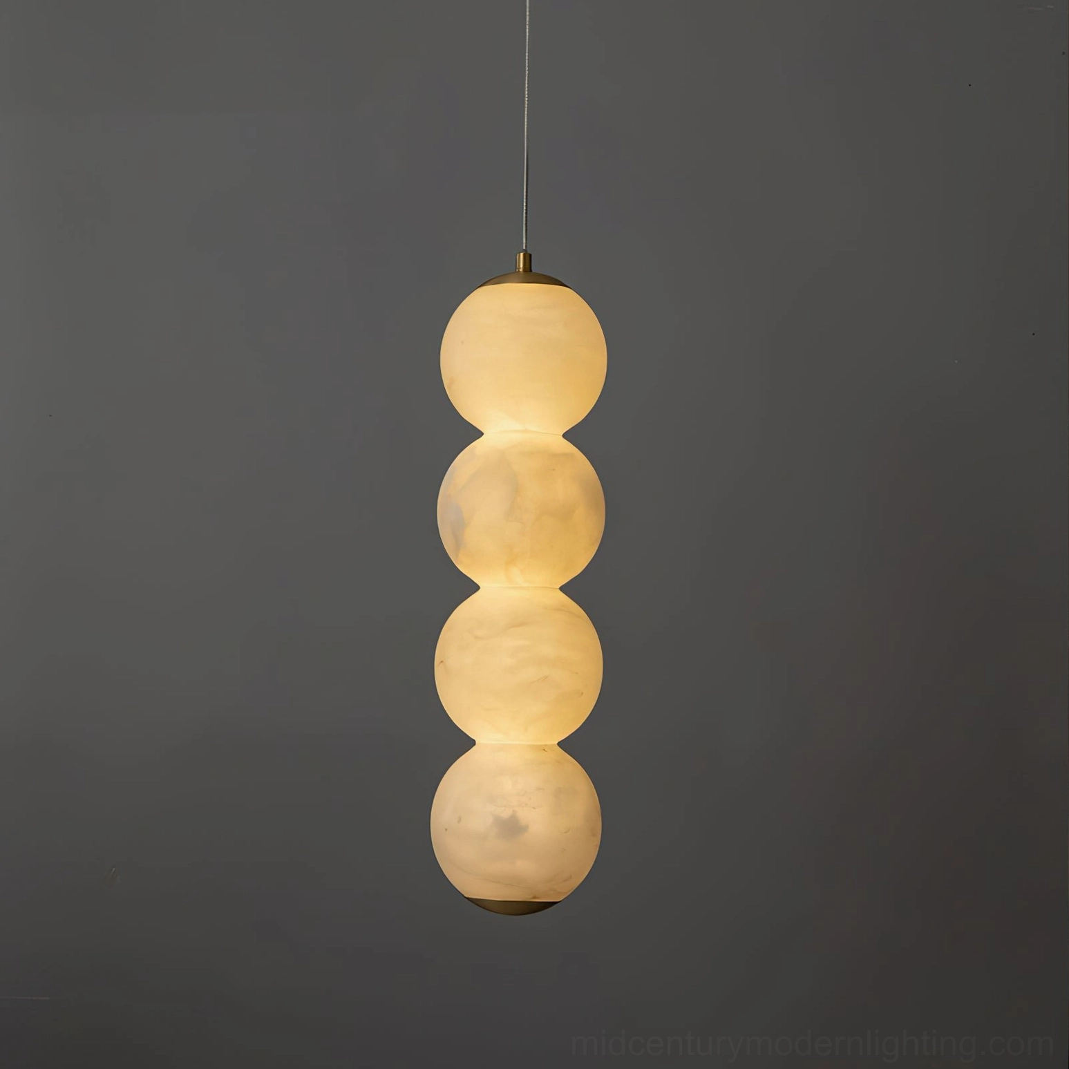 Three stacked alabaster spheres pendant light geometric sculptural modern form