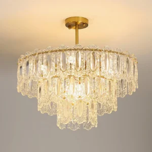 Three-tier Vienna crystal chandelier installed on ceiling with warm glowing light and brass finish