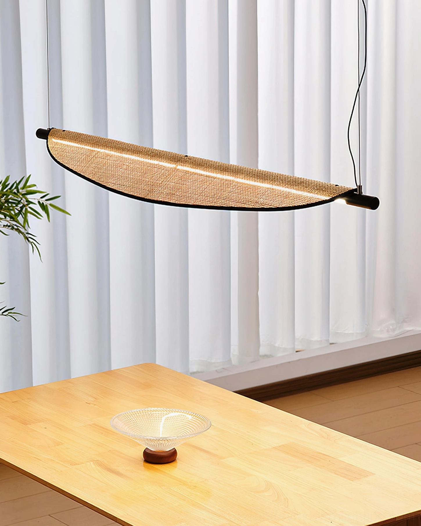 Thula rattan chandelier side angle view in cozy dining room with sheer curtains and japandi styling