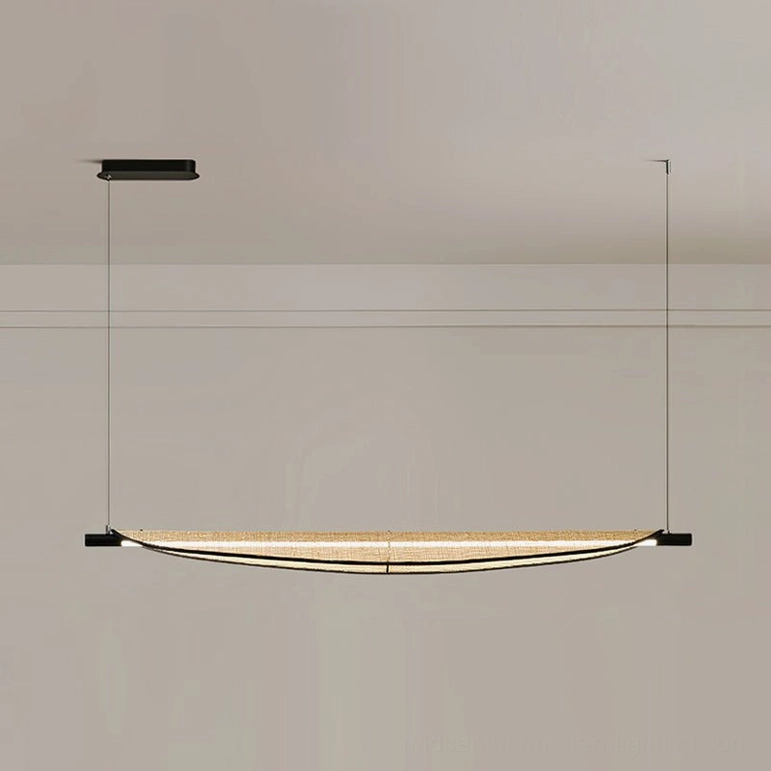 Thula small size linear rattan chandelier suspended over intimate dining table setting