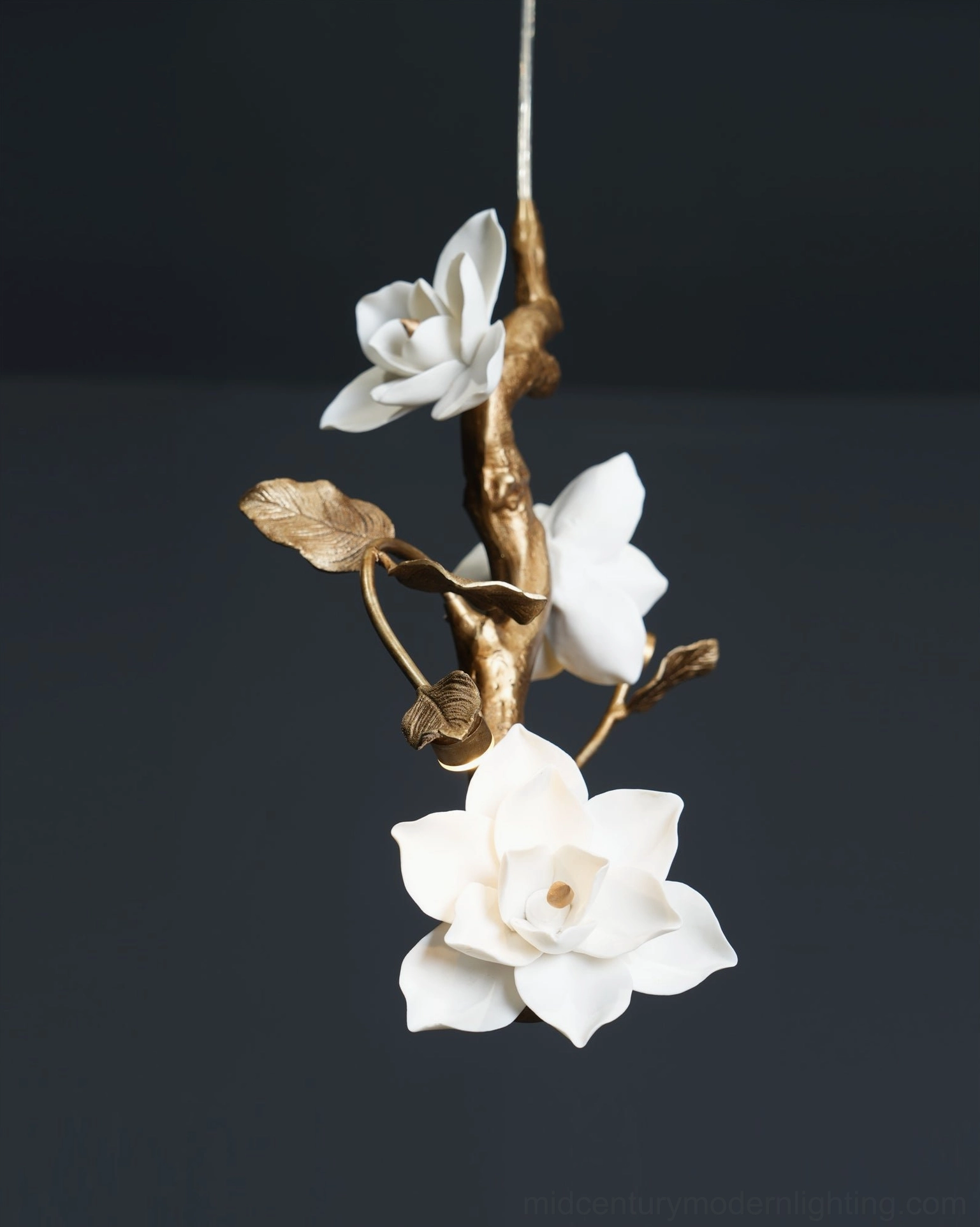 Oblique front close-up of magnolia pendant light with compact floral cluster and bright white ceramic design