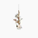 Thylane magnolia flower pendant light with gilt brass frame and white ceramic blooms, front studio view on white background