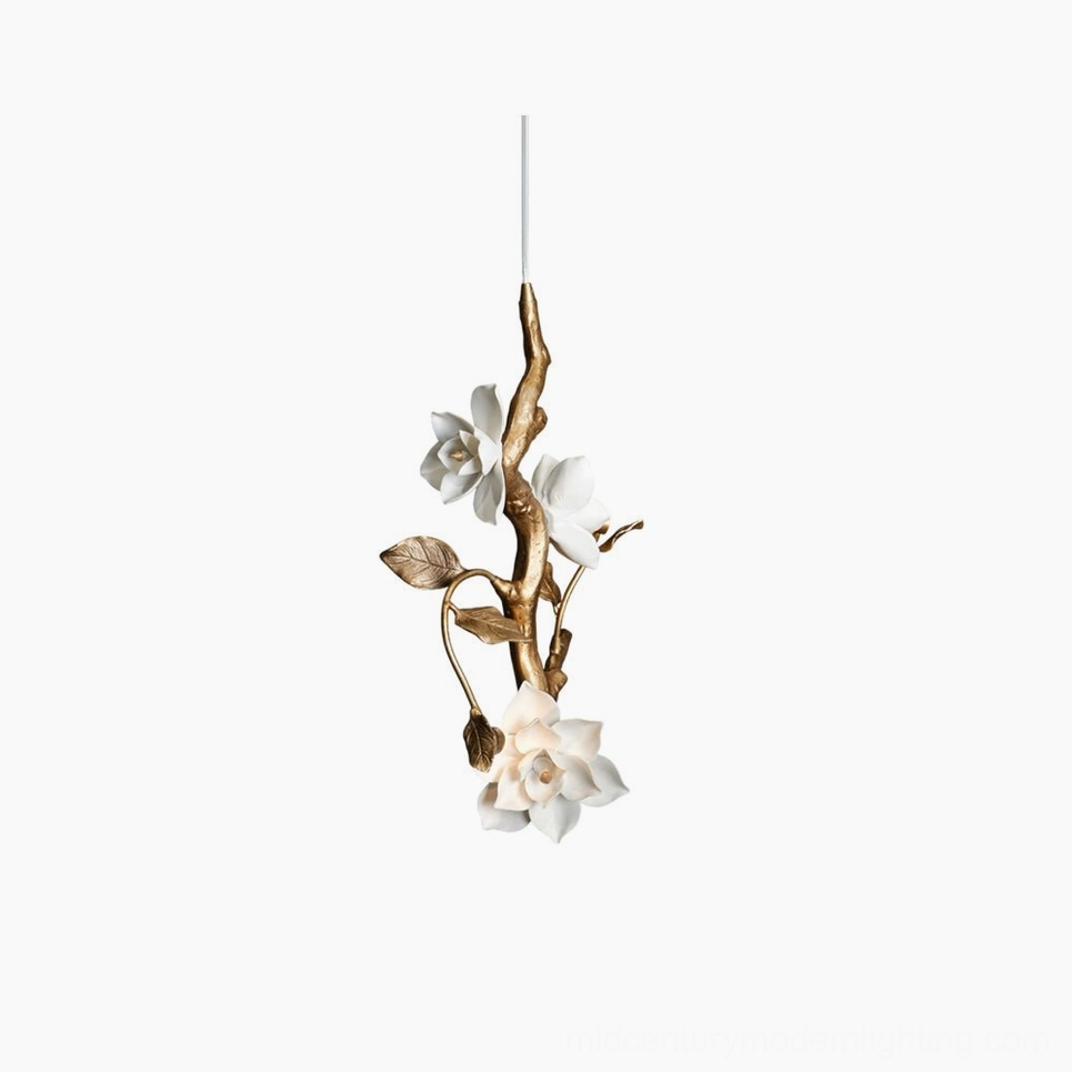 Thylane magnolia flower pendant light with gilt brass frame and white ceramic blooms, front studio view on white background