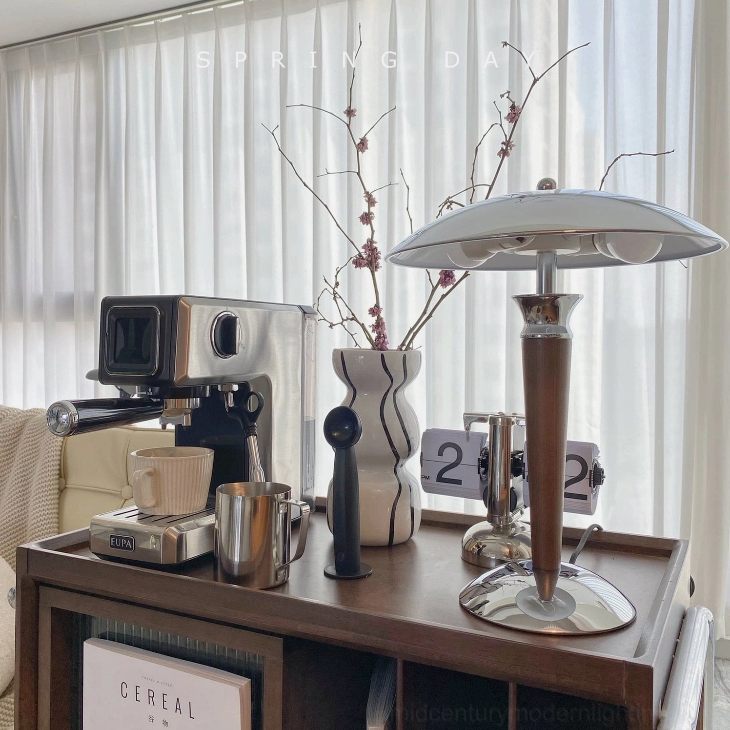 Tibby table lamp positioned on modern glass table surface contemporary styling