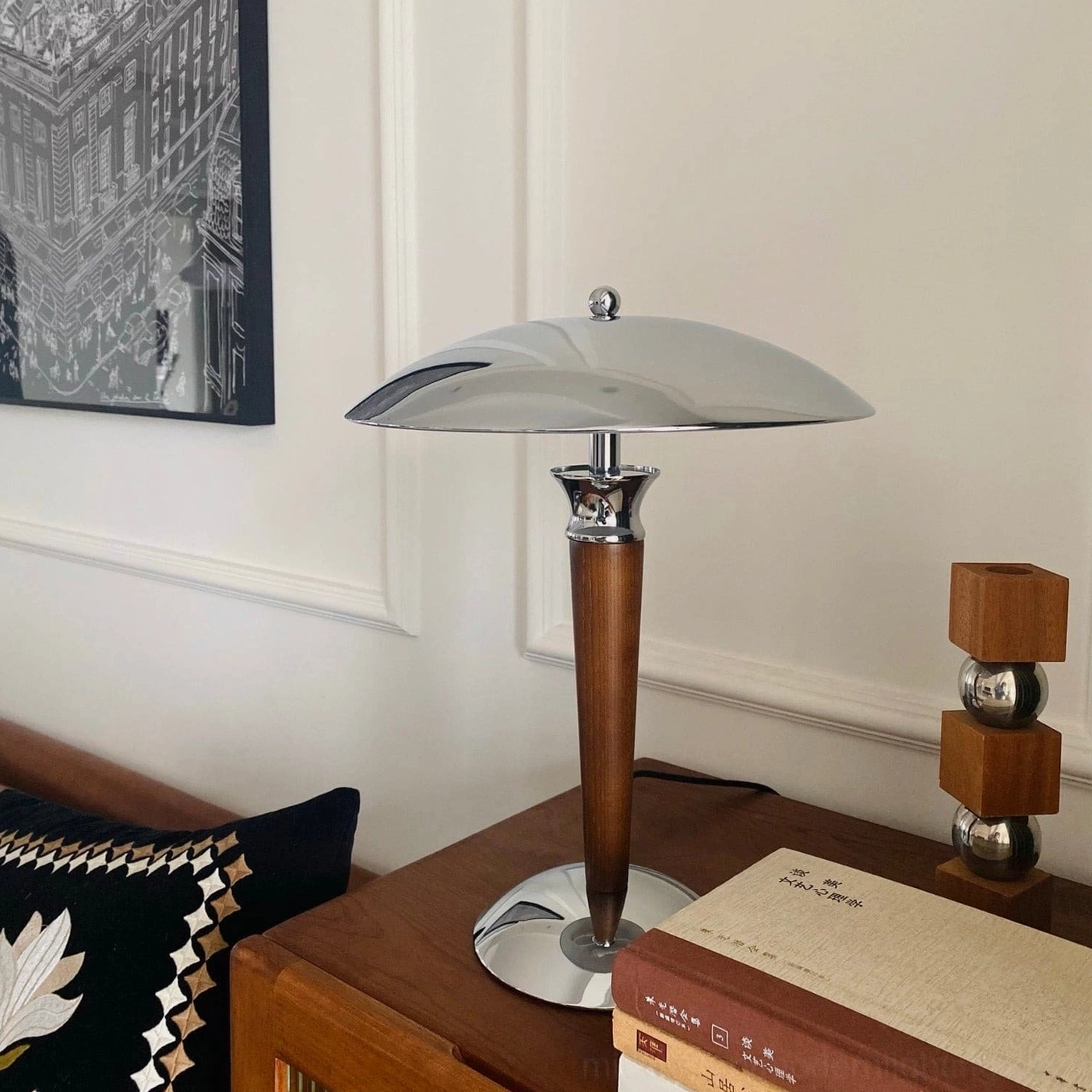 Tibby mushroom lamp with warm light creating ambient shadow cast on wall