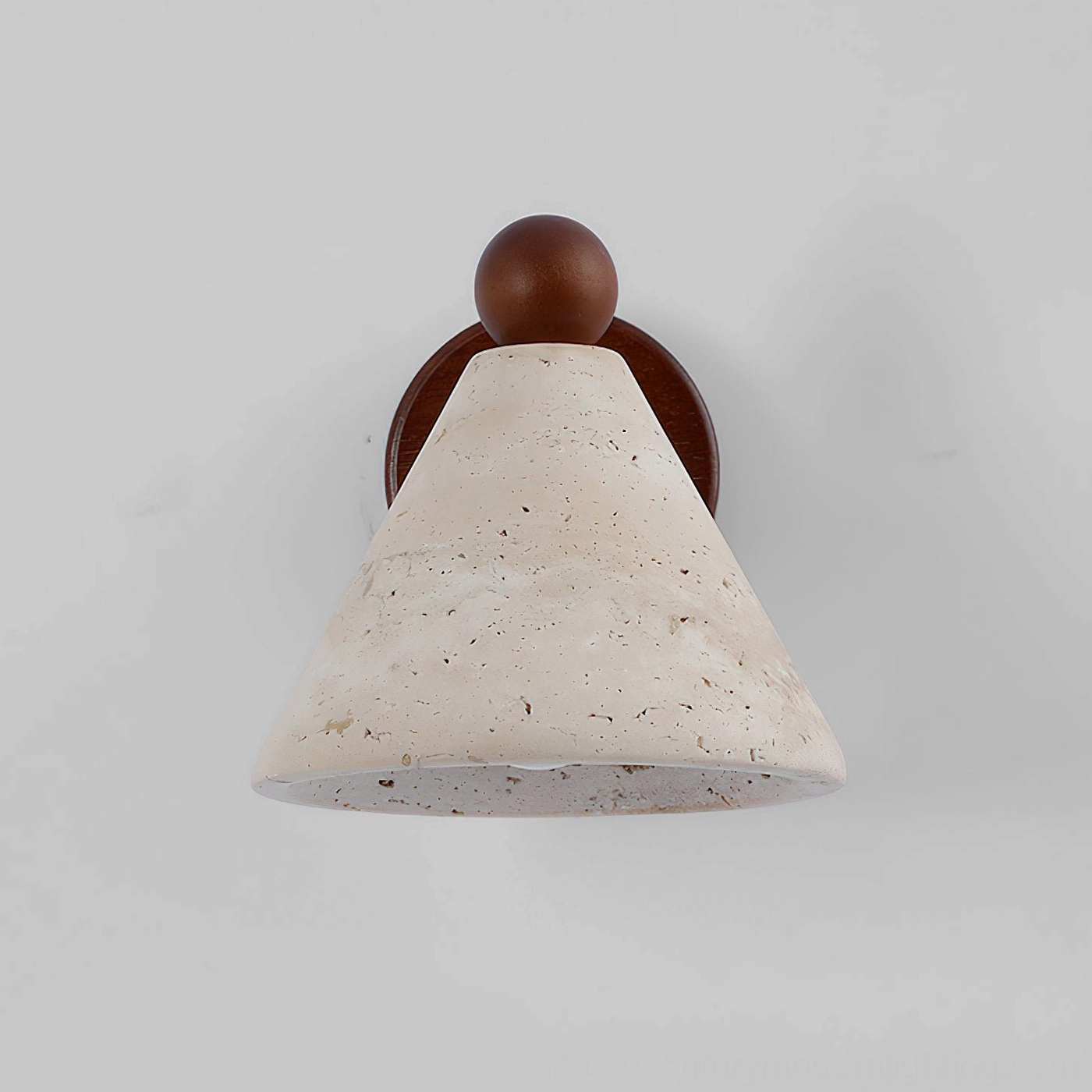 Close-up detail of porous travertine stone shade showing natural veining and textured surface on wall sconce