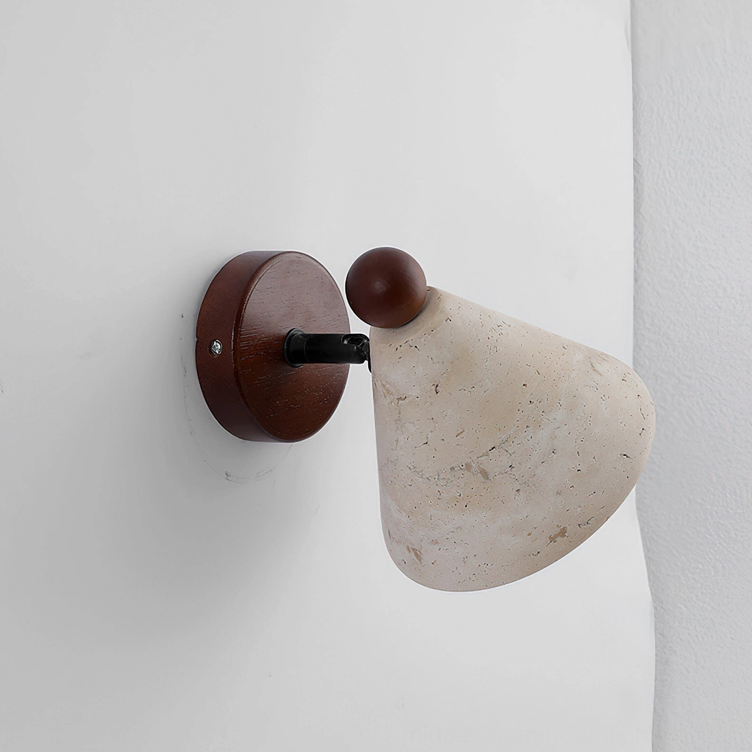 Travertine cone wall light fixture, architectural minimalist design with organic stone and wood materials