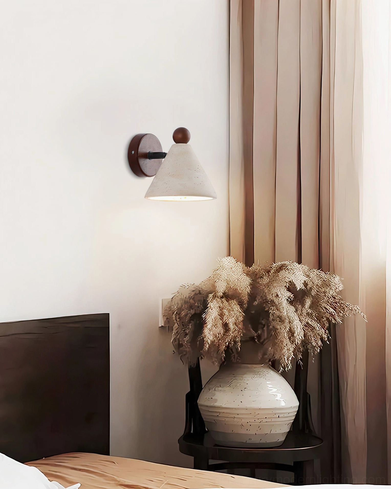 Travertine cone wall sconce with dried flowers, warm boho bedroom interior design aesthetic