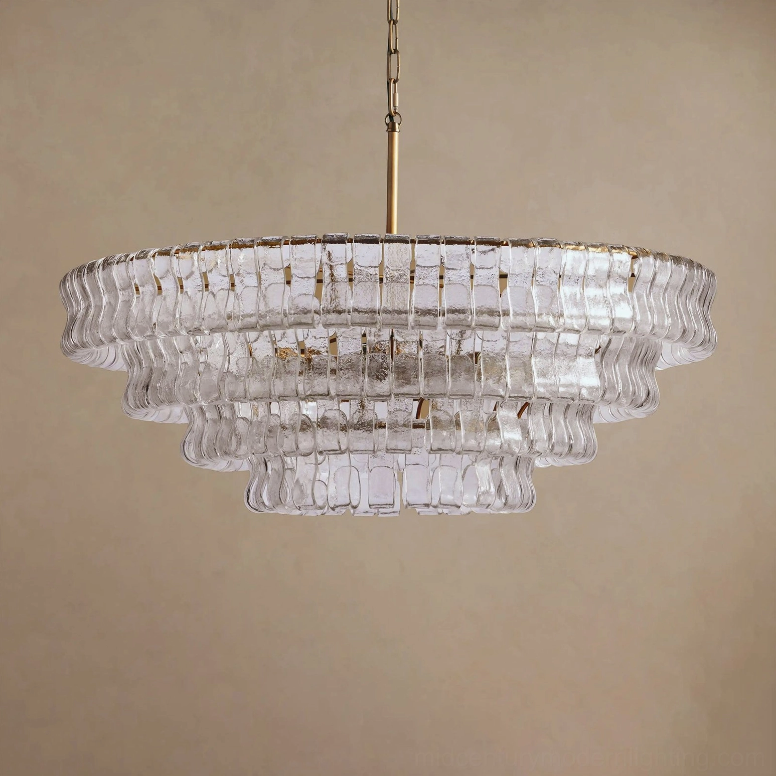 Tiered round chandelier fixture detail, showing concentric descending glass tile rings and metal frame engineering