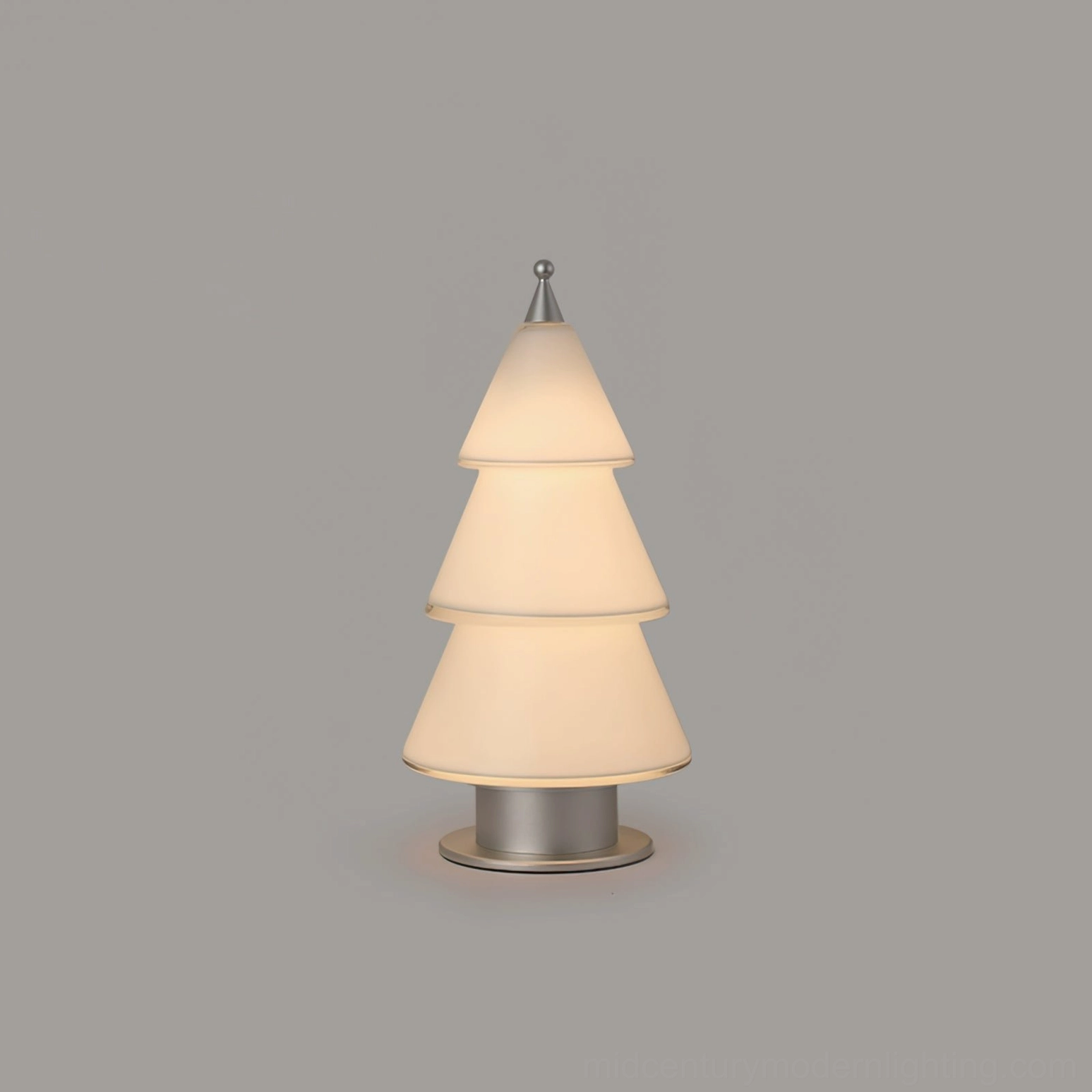 Contemporary minimalist tiered cone table lamp with layered acrylic shade showing LED light diffusion