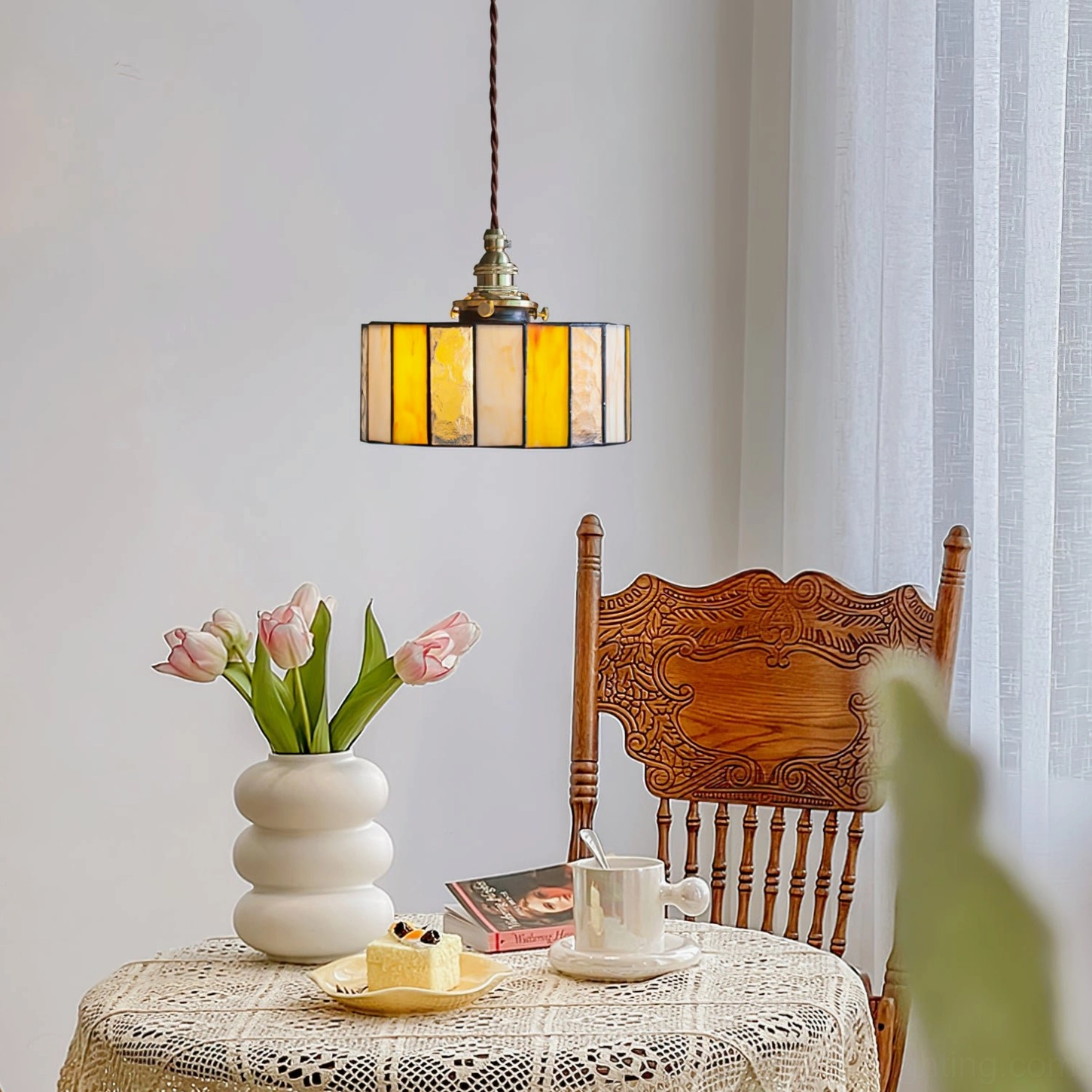 Vintage amber Tiffany-style stained glass drum pendant light with brass hardware, detail view of glass panel construction