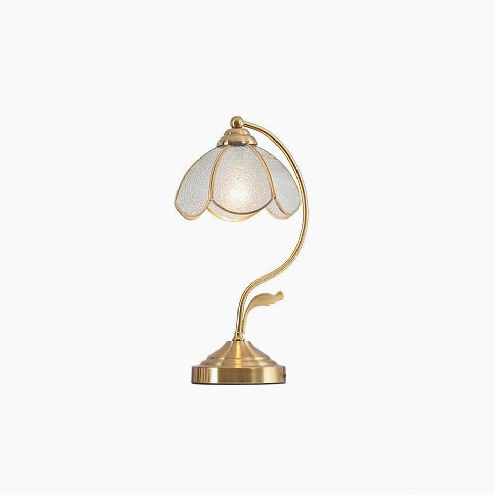 Studio photograph of elegant Tiffany-inspired table lamp with opalescent frosted glass shade and polished brass hardware