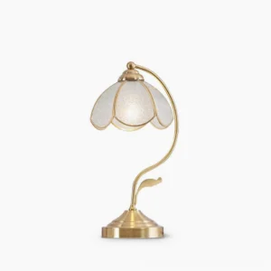 Vintage Tiffany-style blue opalescent glass table lamp with polished brass base and curved metal arm, studio front view