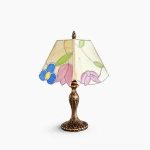 Tiffany stained glass table lamp with hand-rolled glass shade and bronze base, frontal studio view