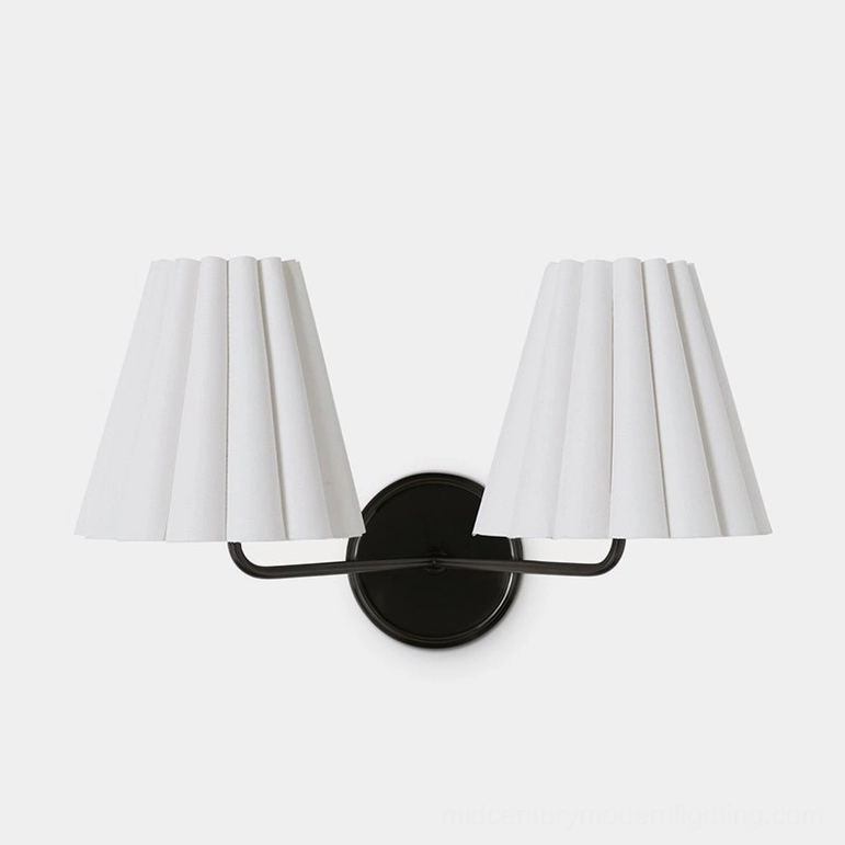 Tilia black and white wall sconce variant showing matte black finish with white pleated shade