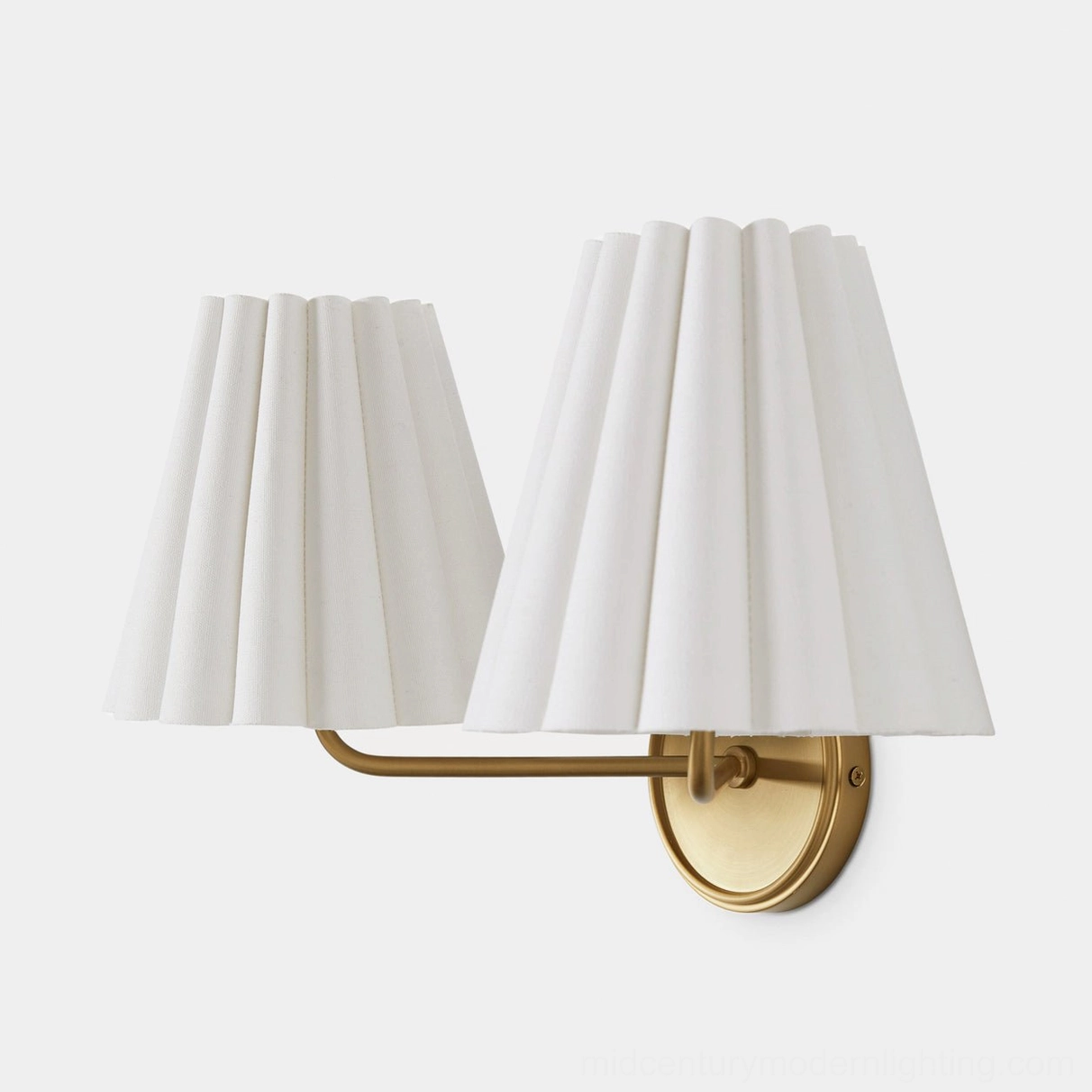 Brass Tilia sconce in Scandinavian inspired bedroom with natural wood furniture and neutral palette