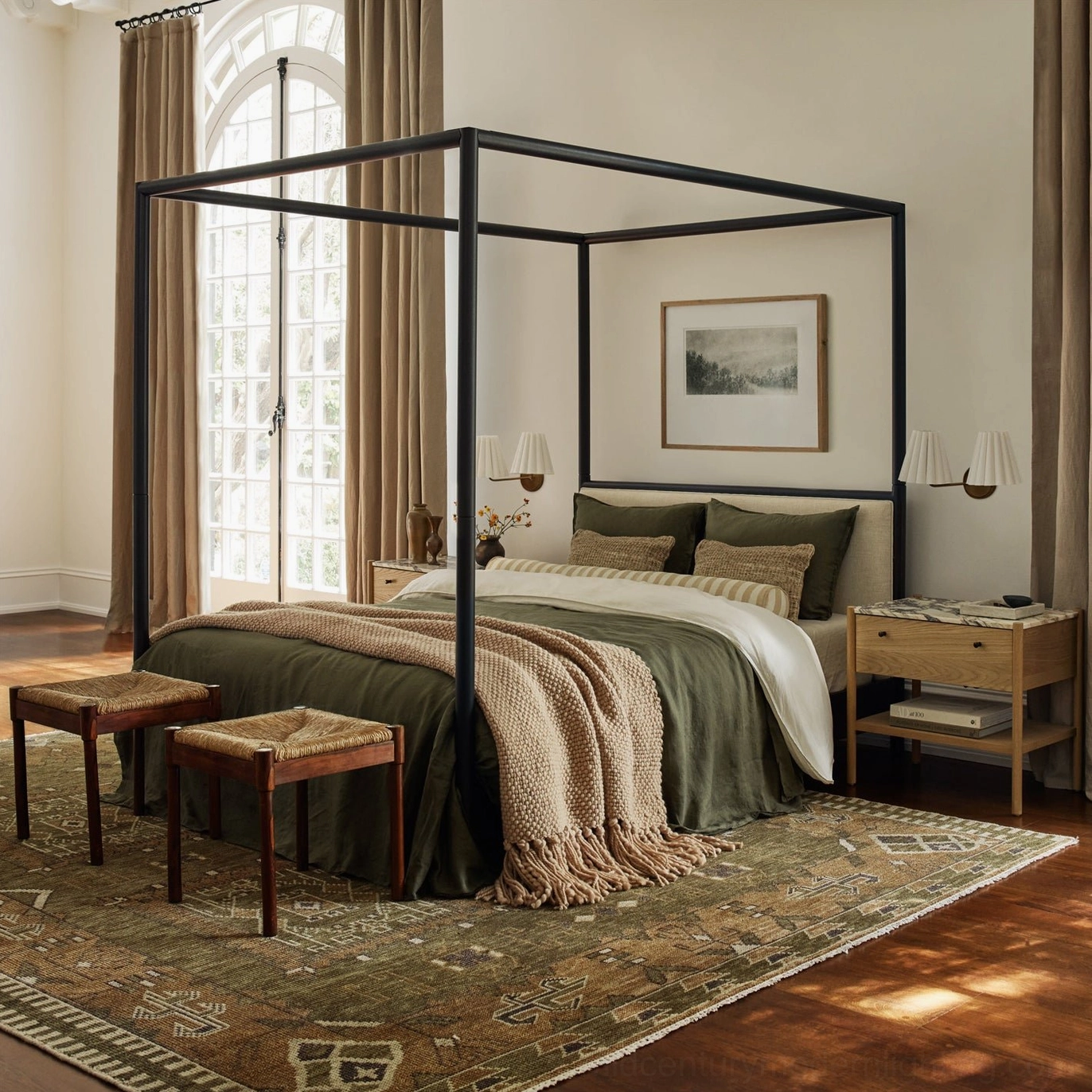 Tilia wall sconce installed in upscale bedroom interior with four-poster bed and warm layered bedding
