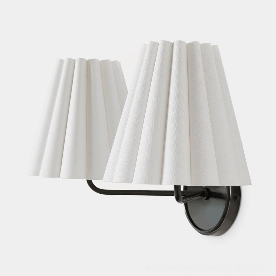Tilia mid-century modern wall sconce in home office reading nook with focused task lighting design