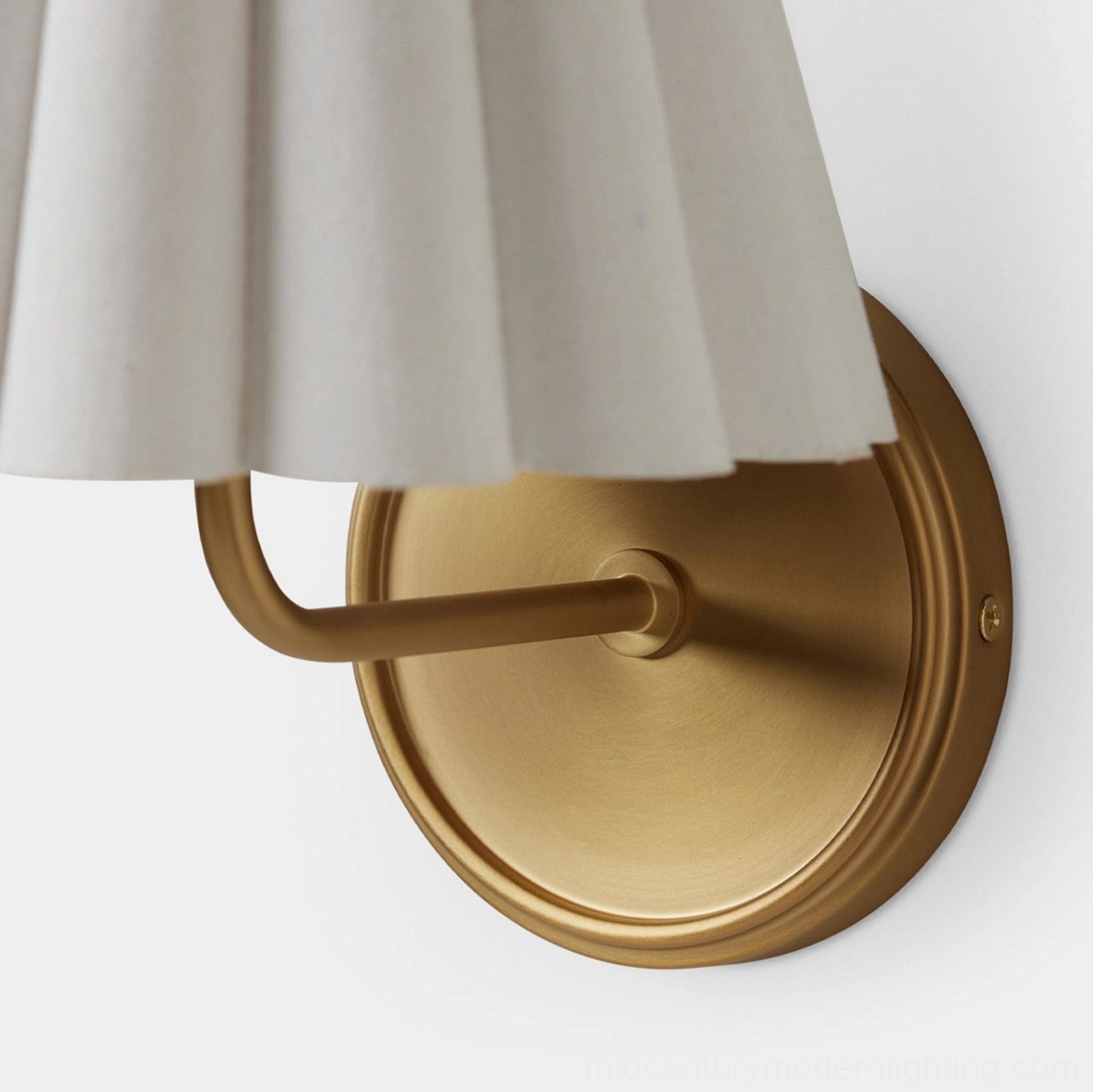 Tilia wall sconce architectural lighting detail showing fabric shade geometry and light diffusion