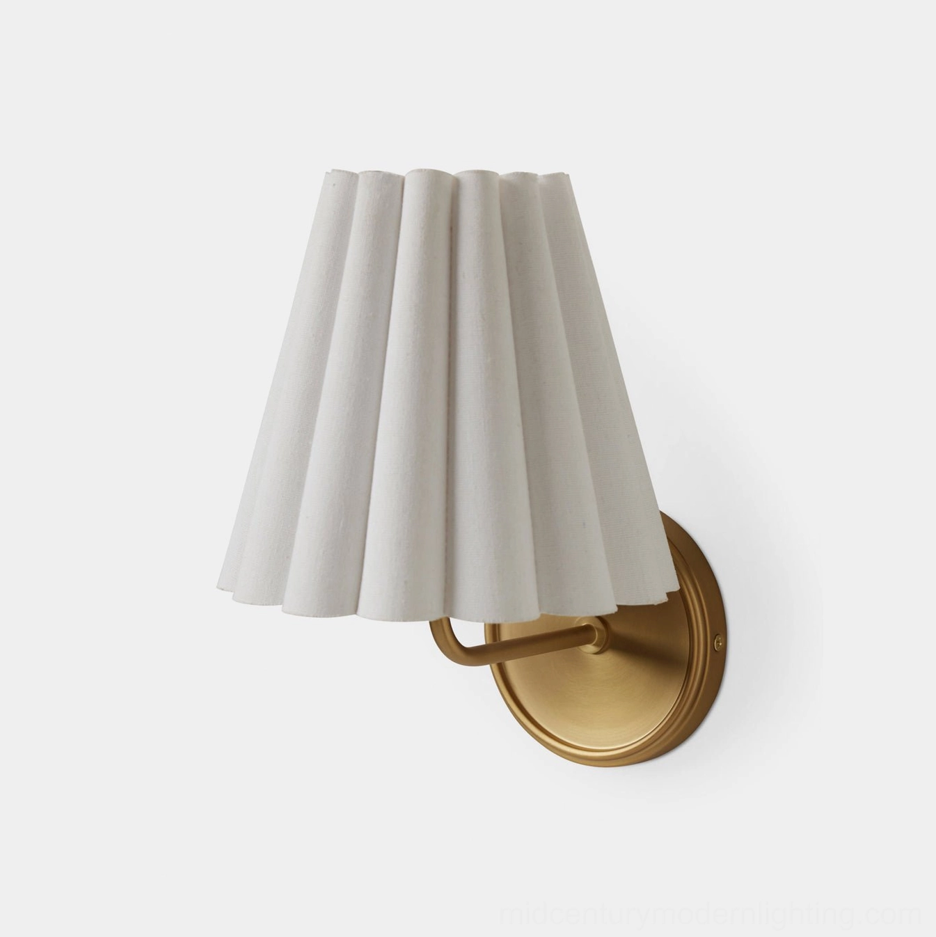 Tilia wall sconce reading light above bedroom nightstand with warm ambient glow on white wall