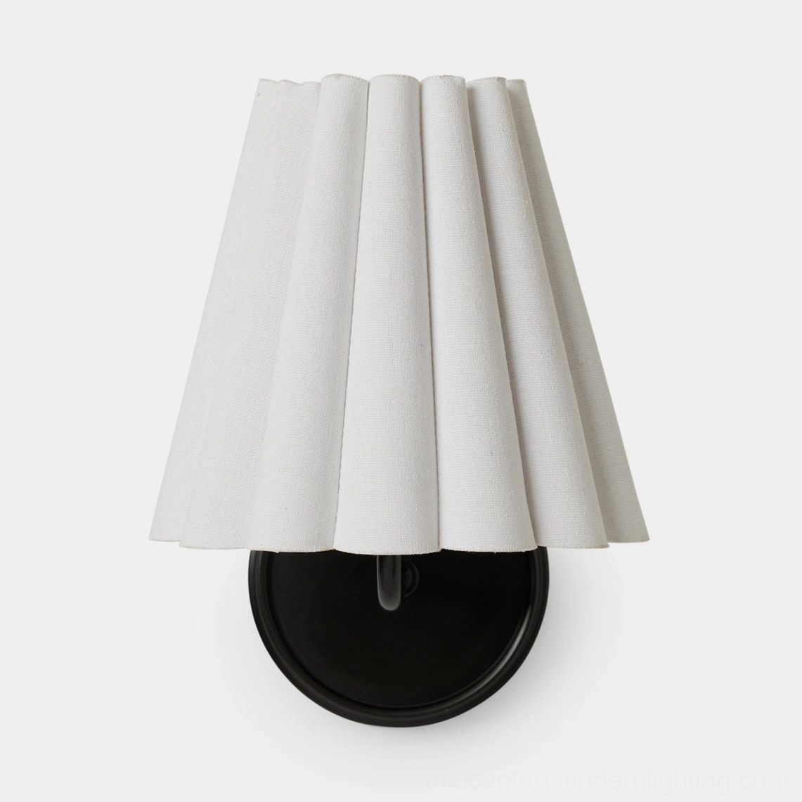 Tilia mid-century modern wall sconce installation showing side profile and ambient lighting effect