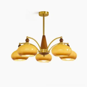 Tillary 5-head wood and brass chandelier with clear glass shades, front overhead view on white background