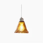 Tiro amber glass pendant light with hand-blown wavy shade and chrome metal fixture, front studio view against white background