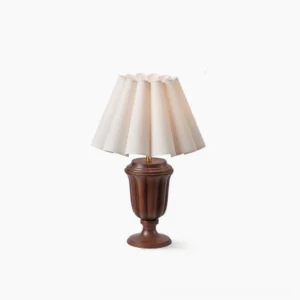 Tisdale mid-century modern table lamp with fluted walnut wood base and off-white pleated linen shade, front studio view