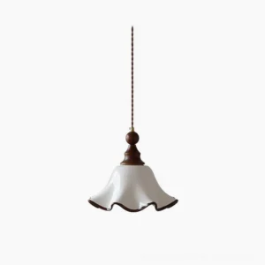 Toledo wave ceramic pendant light with white flared shade and walnut wood trim, front view against studio backdrop