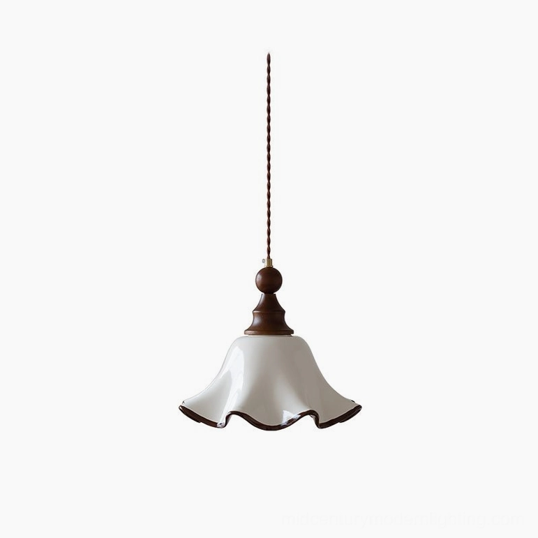 Toledo wave ceramic pendant light with white flared shade and walnut wood trim, front view against studio backdrop