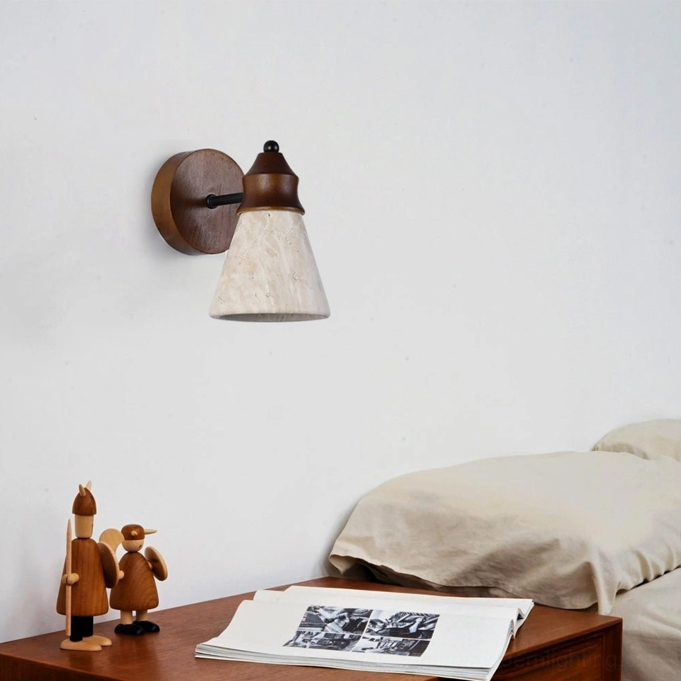 Travertine wall sconce mounted in minimalist bedroom beside wooden nightstand, side profile showing warm ambient lighting