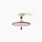 Tomaso mid-century modern flush mount ceiling light with cream finish and walnut wood accent, overhead studio view